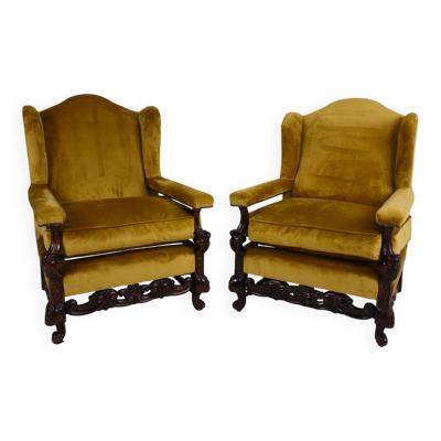 Paire de fauteuils en noyer sculpté du XIXe siècle – motifs floraux – revêtement en velours