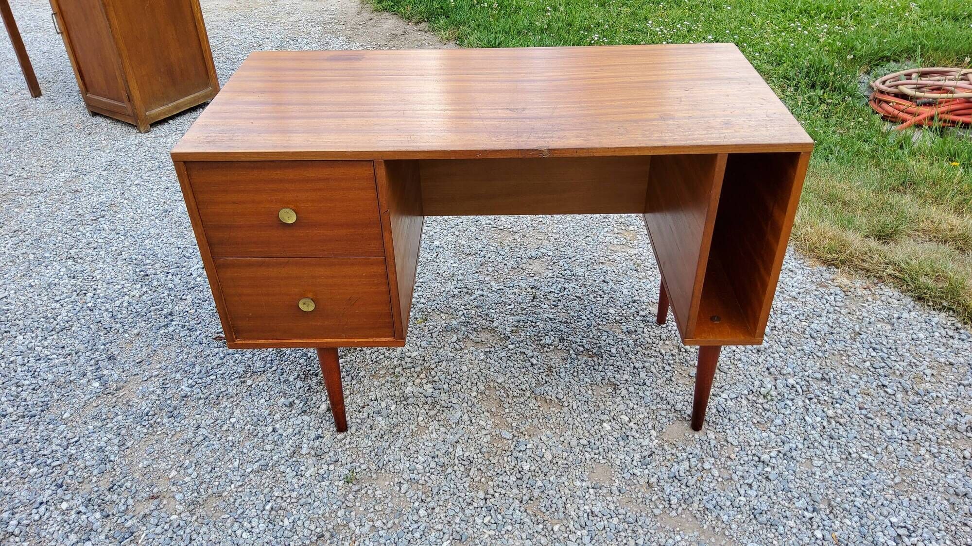 60s desk in golden blond mahogany with conical coffered feet
