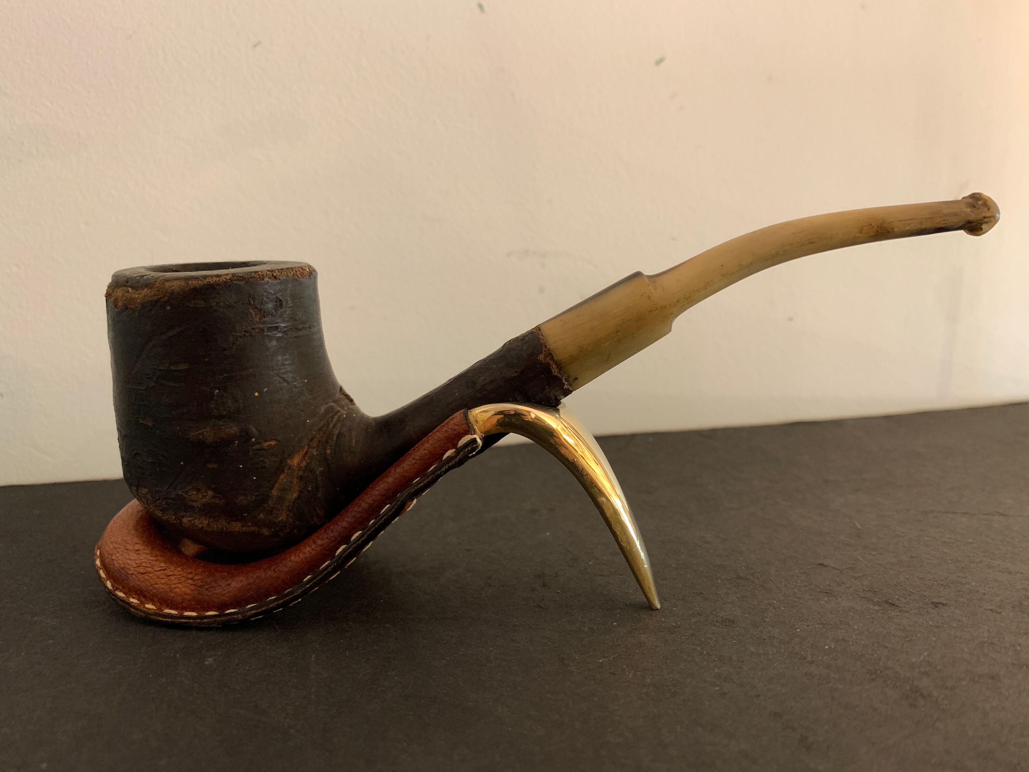 Carl Auböck pipe rack in leather and bronze, 1963