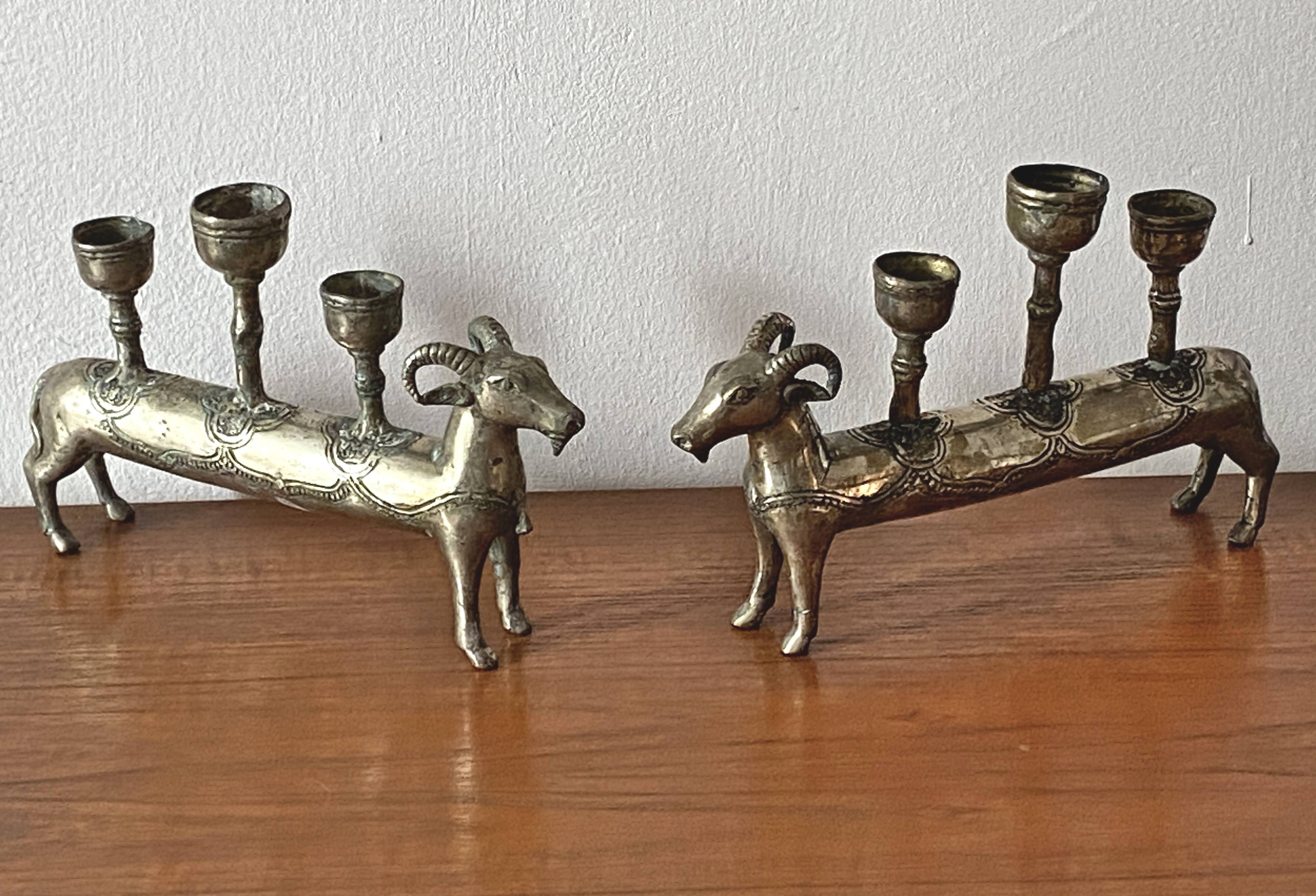 Pair of religious silver-plated zoomorphic candlesticks