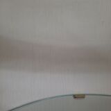 Armoire à barre vintage en forme de cylindre ouvrable, bois, laiton et verre.