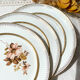 8 Petites assiettes en porcelaine OLYMPIA motif fleuris et dorure