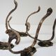Four patères bronze patinated leafy décor early 20th century
