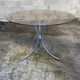 Table with chrome metal legs and smoked glass top.