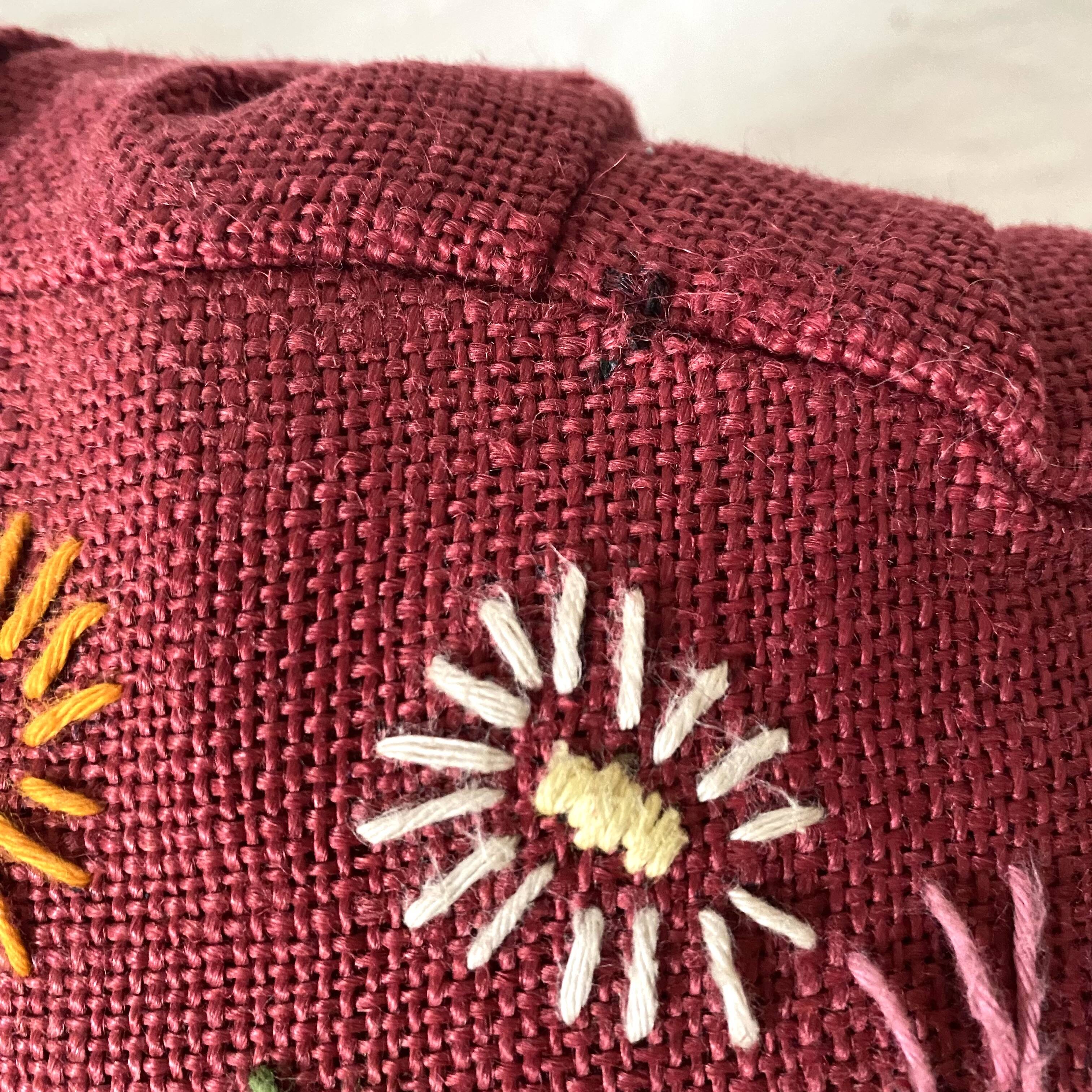 Paire de coussins ronds vintage en lin brodé