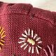 Paire de coussins ronds vintage en lin brodé