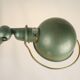 Jielde table lamp with 2 arms on a wooden base.