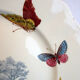 Assiette polychrome signée Kg Luneville 19ème lys et papillons