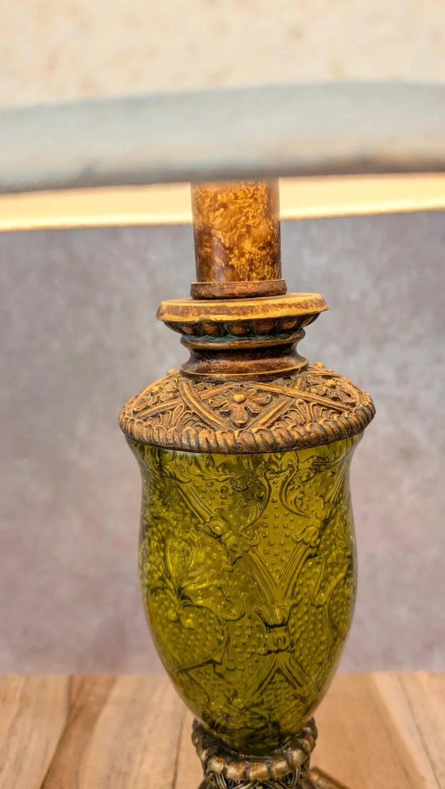 Vintage lamp with bronze imitation base & green relief glass in an antique style.