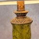 Vintage lamp with bronze imitation base & green relief glass in an antique style.