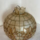 Large mother-of-pearl and brass chandelier with floral decoration.