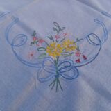 Embroidered tablecloth and table runner