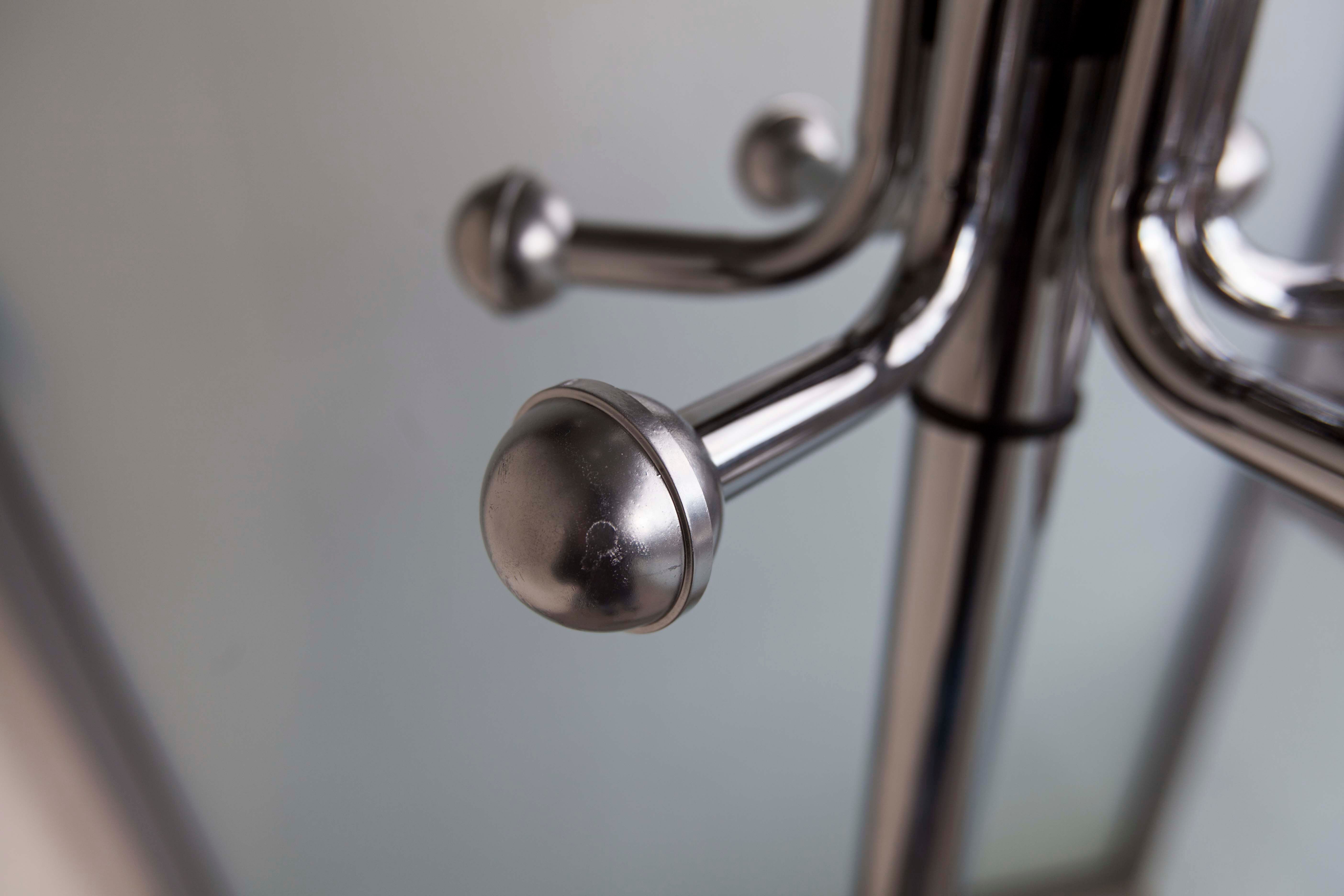 Chrome metal parrot coat holder from the 70s