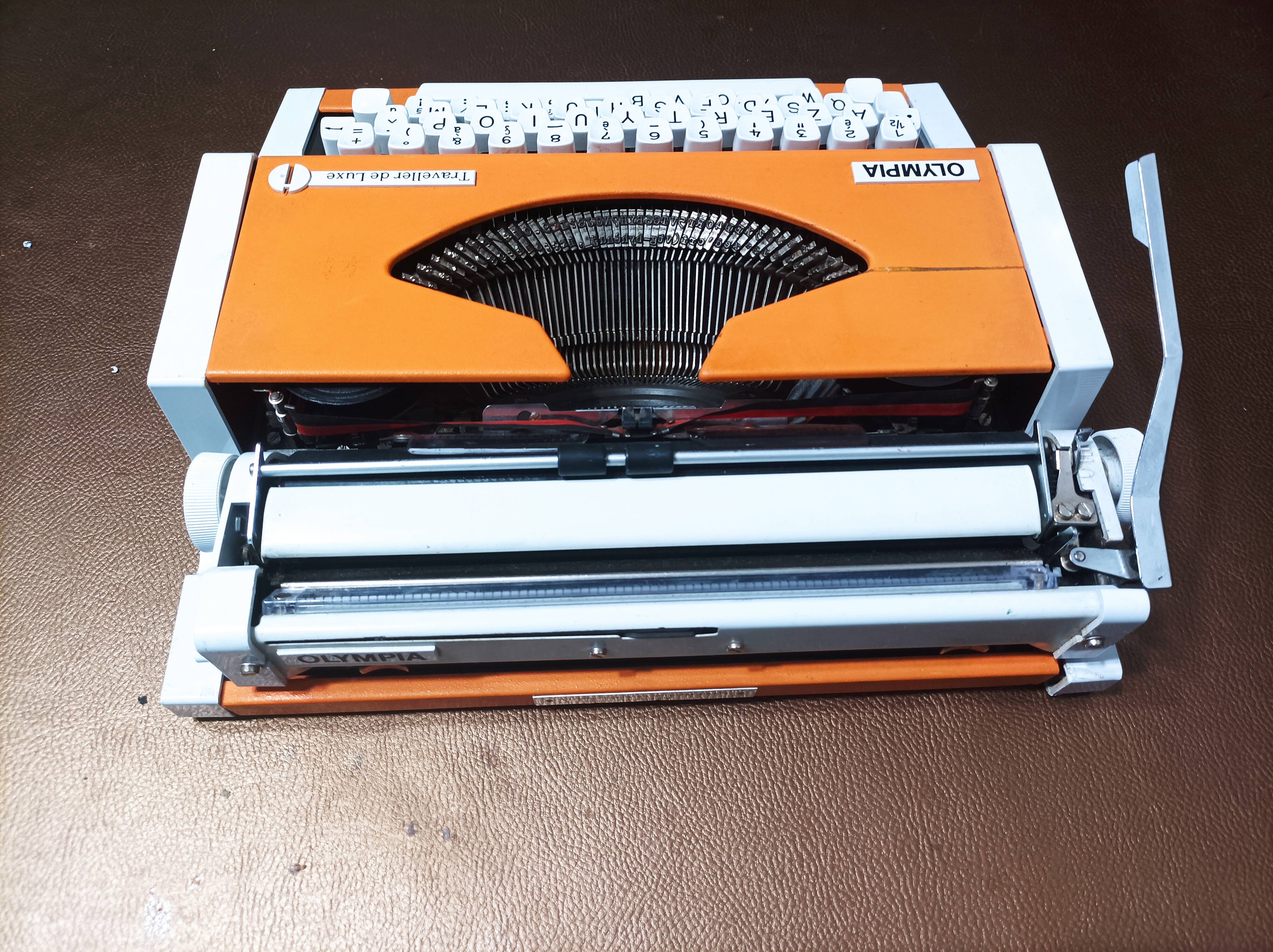 Olympia traveller luxury typewriter orange revised and new ribbon