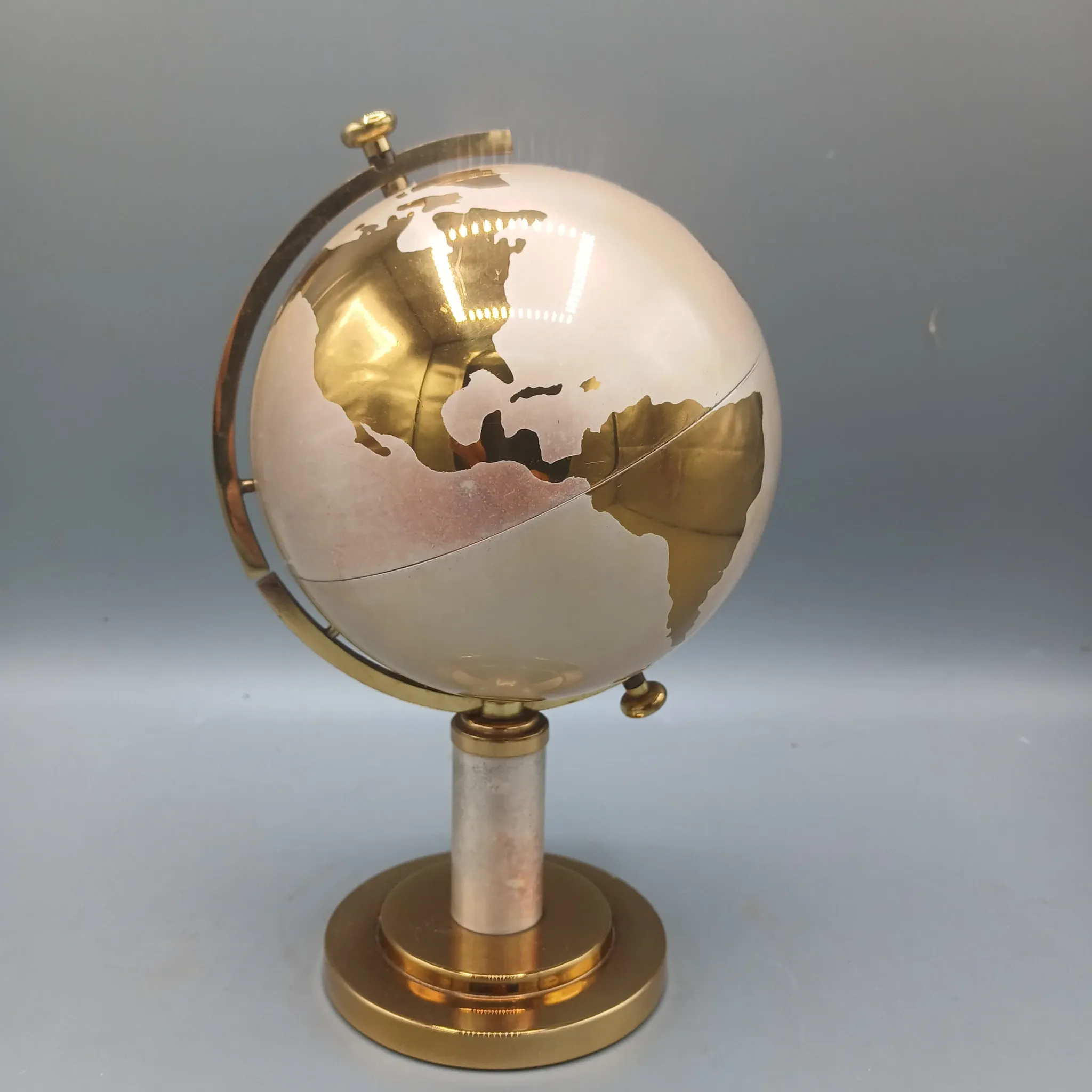Vintage brass globe cigarette dispenser