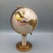 Vintage brass globe cigarette dispenser