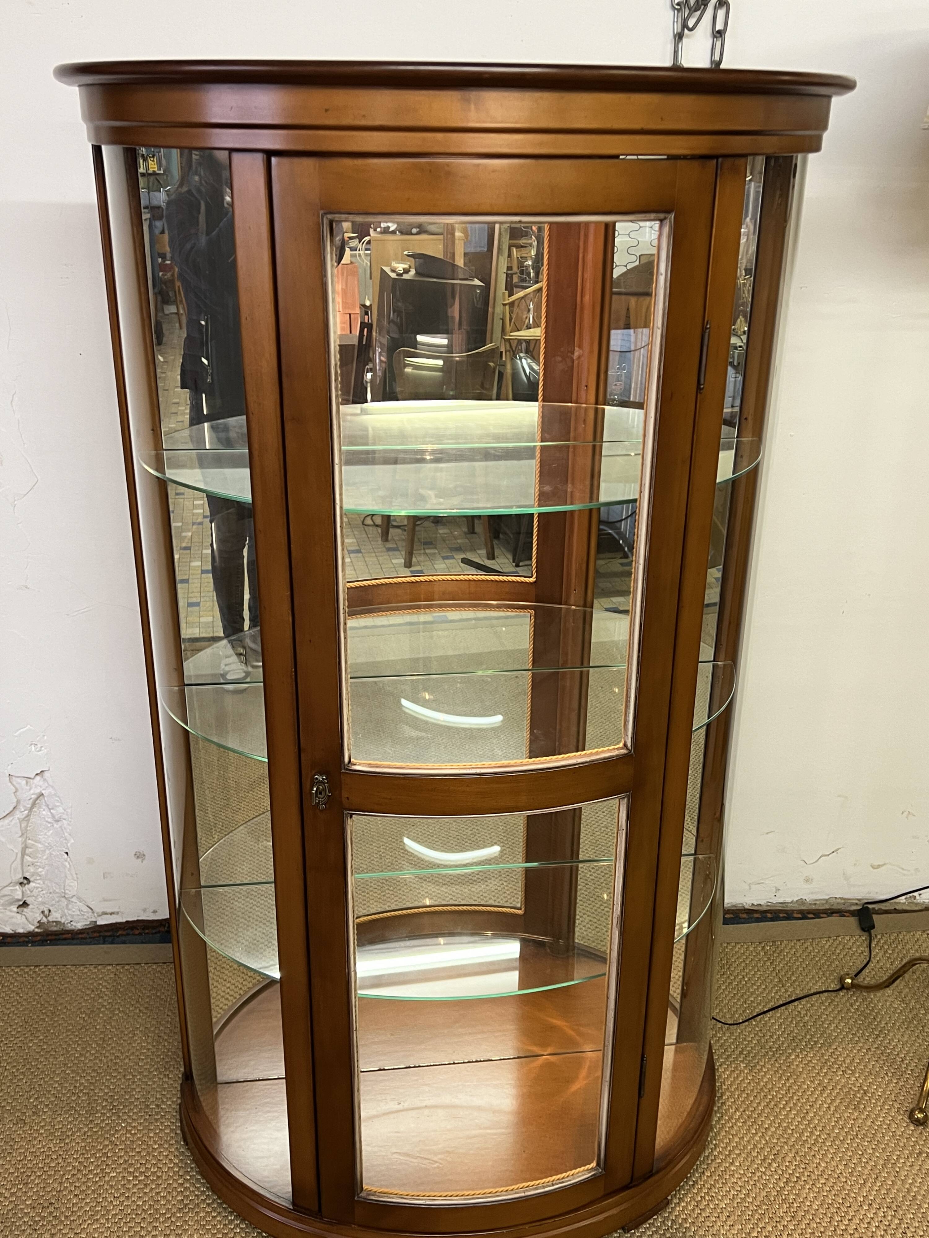 Wooden display case and half-moon mirror