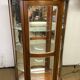 Wooden display case and half-moon mirror