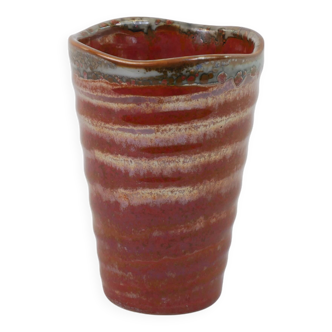Small orange glazed ceramic cup