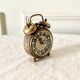 Small alarm clock old vintage watch in copper brass