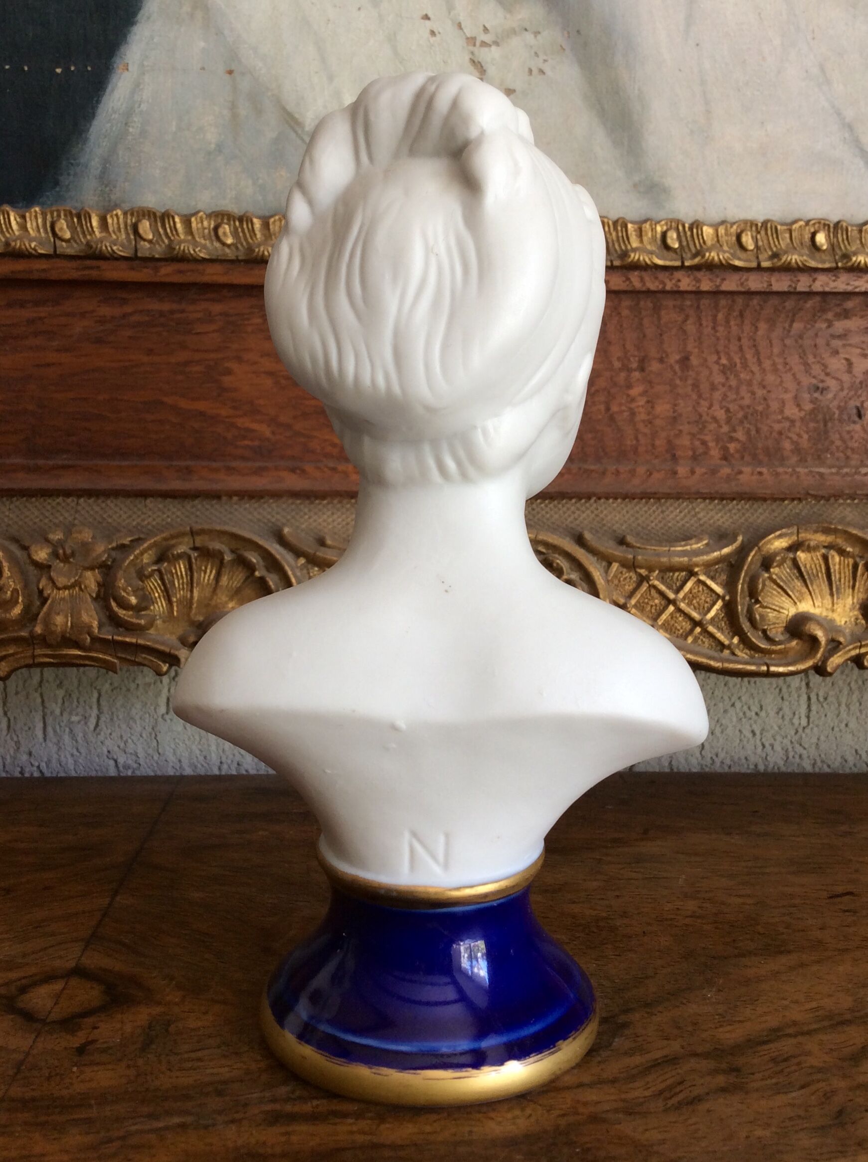 Small biscuit bust with blue base