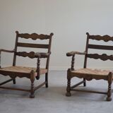 A pair of modern and sculptural vintage Danish armchairs in oak and papercord, 1940s.