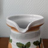 Ceramic pitcher with apple motif