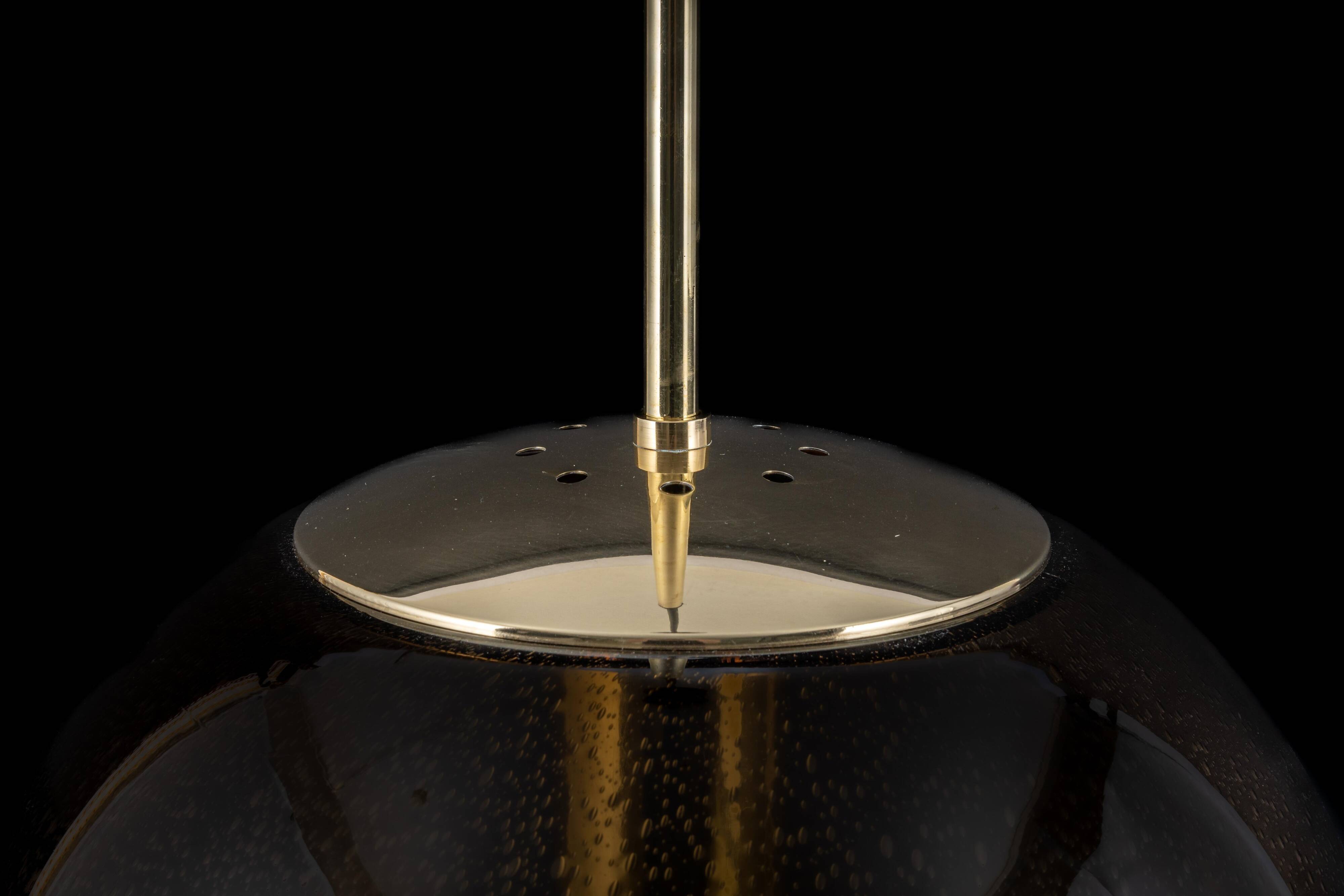 Large smoked glass ball pendant by Limburg with brass, Germany, 1970s.