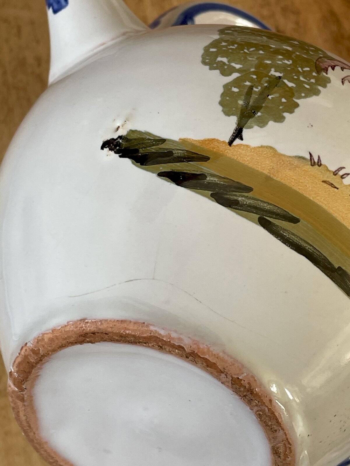 Crucible, ancient teapot made of terracotta.