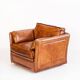Vintage club armchair by Roche Bobois. Camel buffalo leather. France, 1980s.
