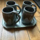 Set of 4 cups and 1 signed brutalist tray.