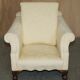 Pair of Edwardian armchairs from 1910 with carved legs and fabric.