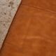 Ottoman with leather upholstery