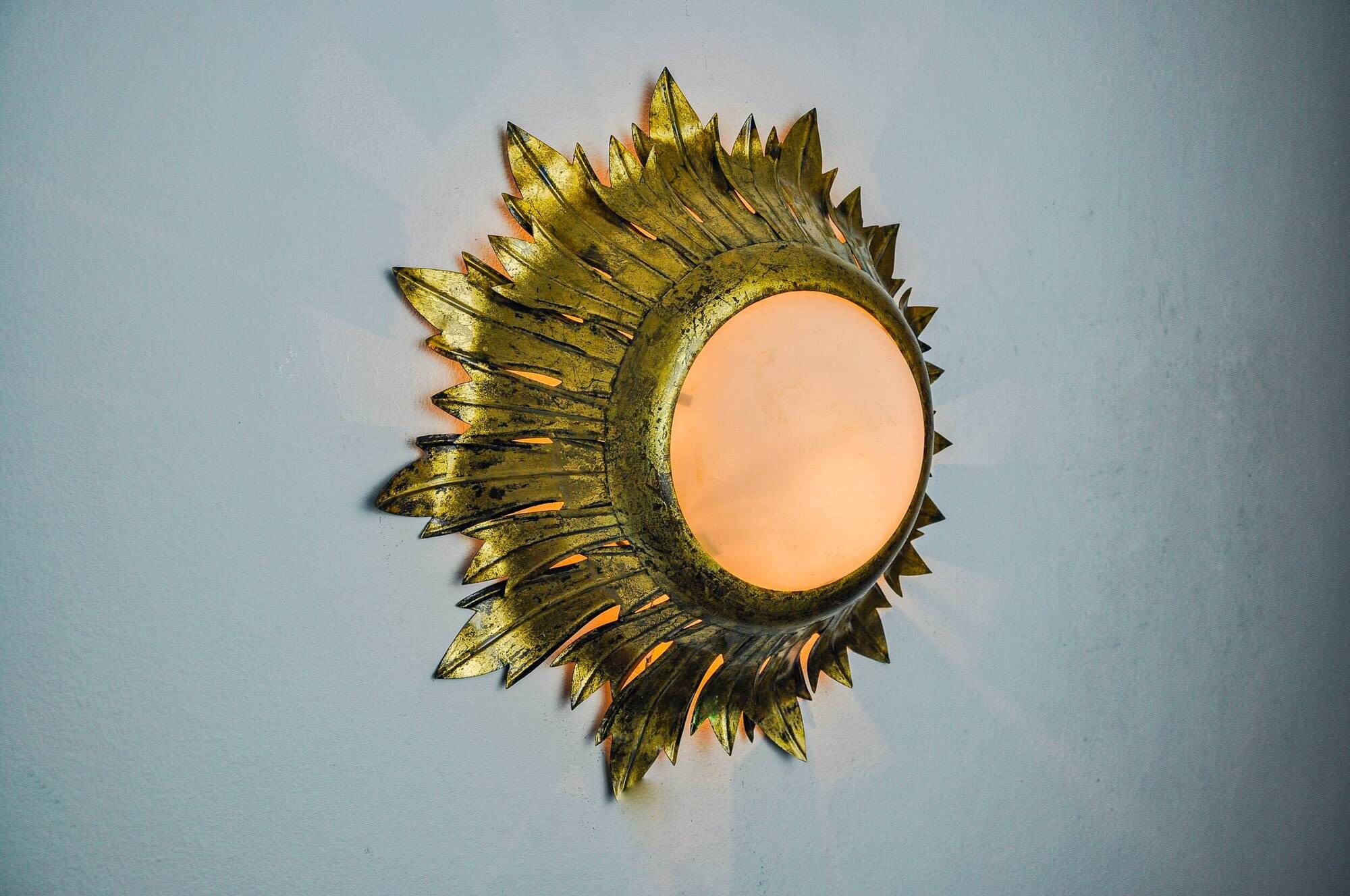 Sun wall lamp by ferro arte, metal and gold leaf, Spain, 1960