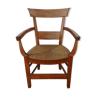 Antique armchair in wood and straw