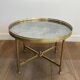 Brass coffee table with a vintage mirror top from the Baguès house.