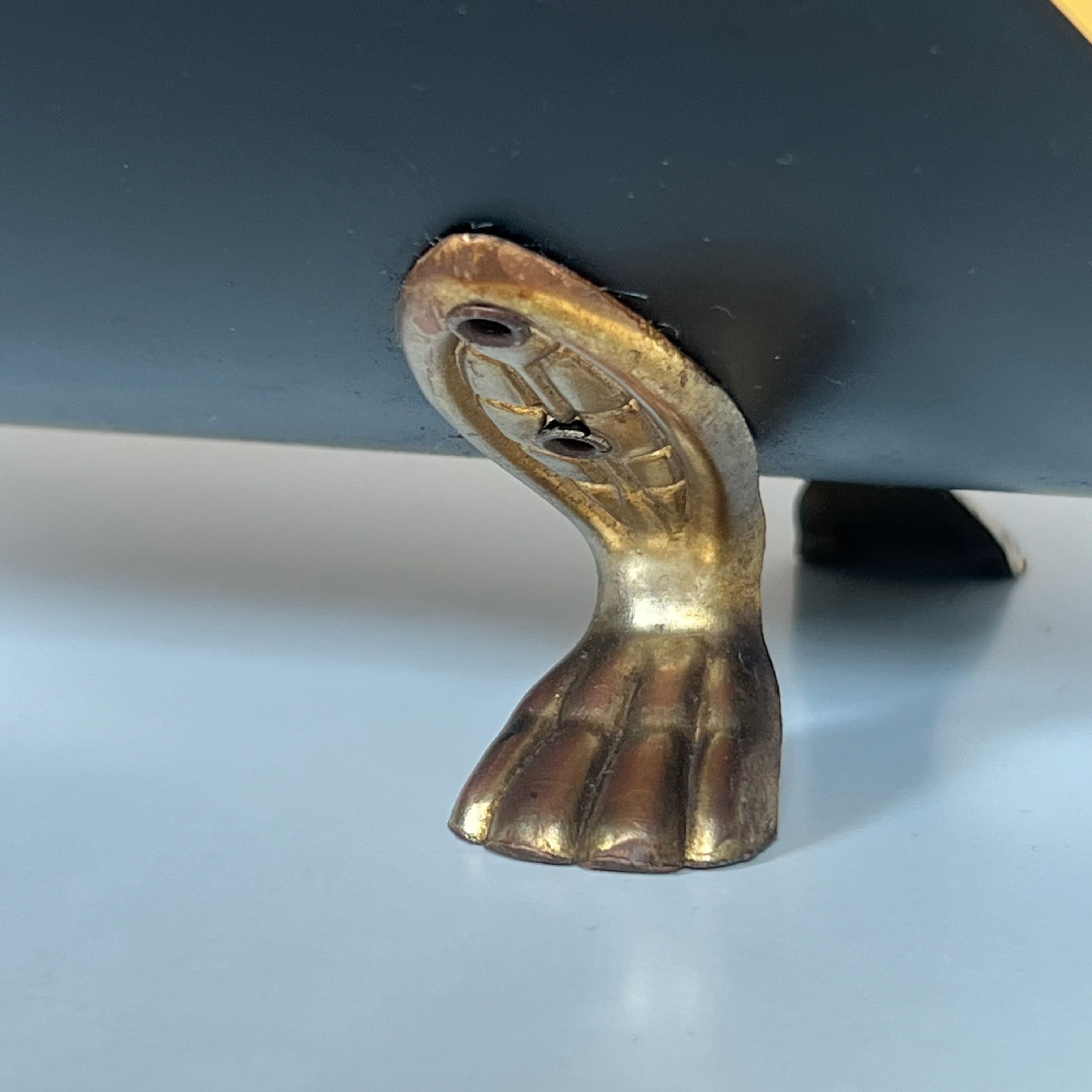 Neoclassical log holder in brass and black lacquered brass