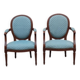 Paire de fauteuils médaillon style Louis XVI