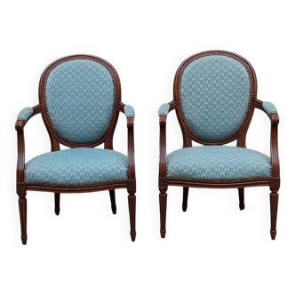 Paire de fauteuils médaillon style Louis XVI