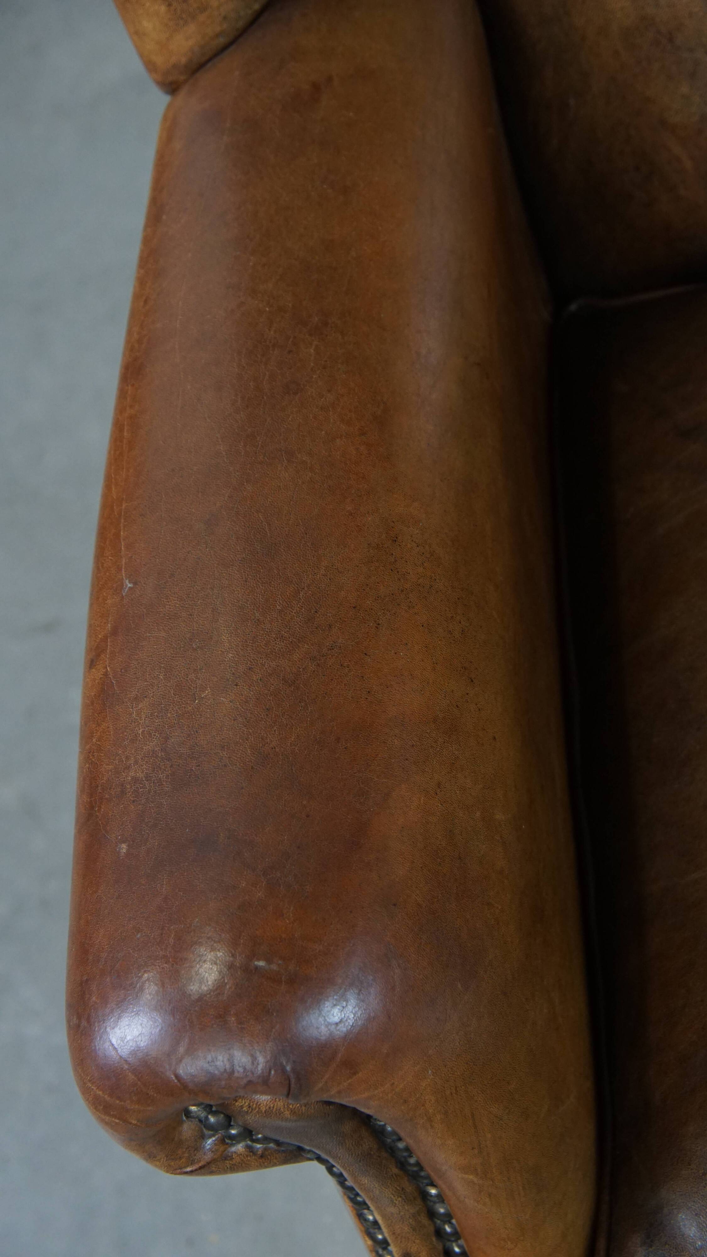 Sheep leather wingback chair with patina