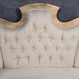 Banquette vintage à dossier capitonné, revêtu d’un tissu ivoire