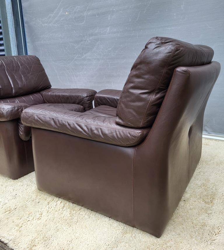 Pair of chocolate leather lounge chairs
