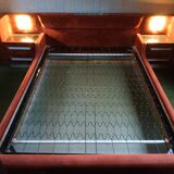 Vintage bed from the 70s with radio and built-in bedside lamp