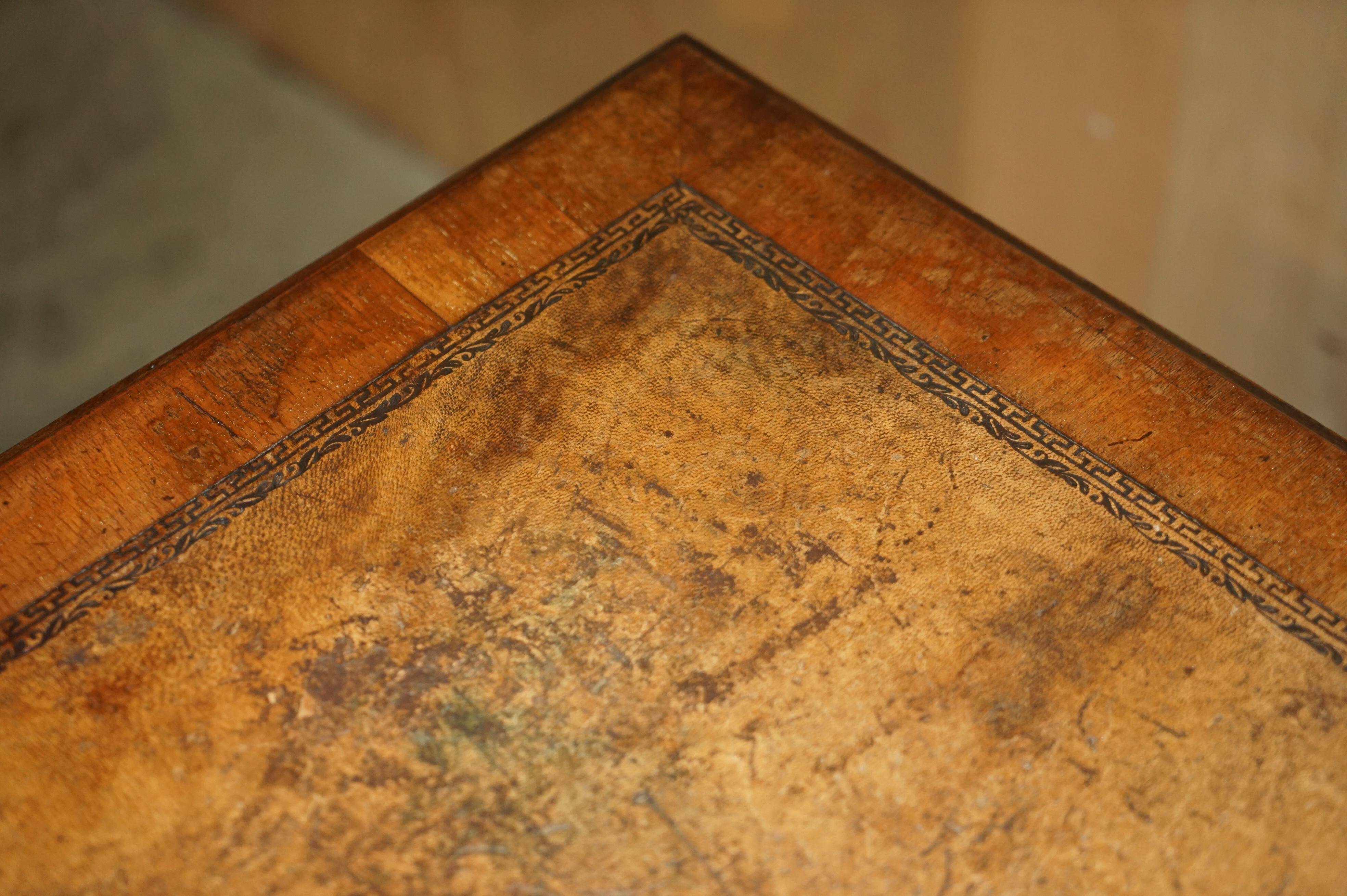 Victorian antique partner's desk in veined walnut with a leather top.