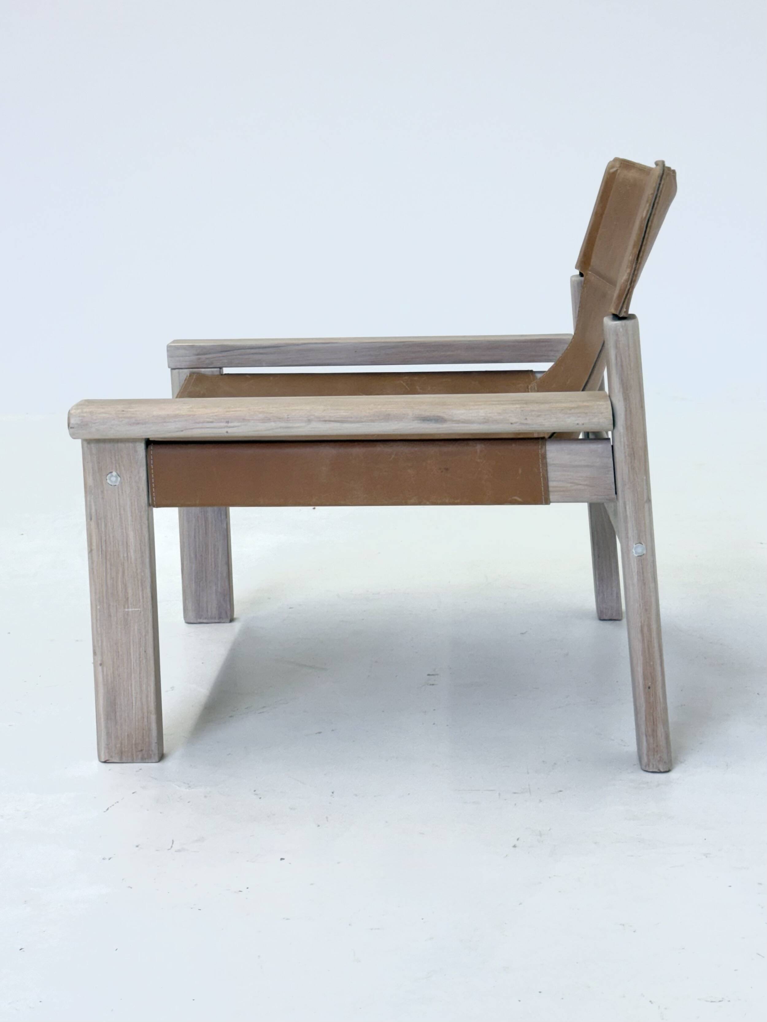Stylish vintage armchair with saddle leather seat