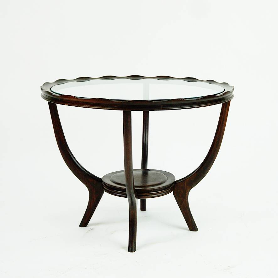 Italian round coffee table from the 1950s with a glass top, attributed to Carlo di Carli.