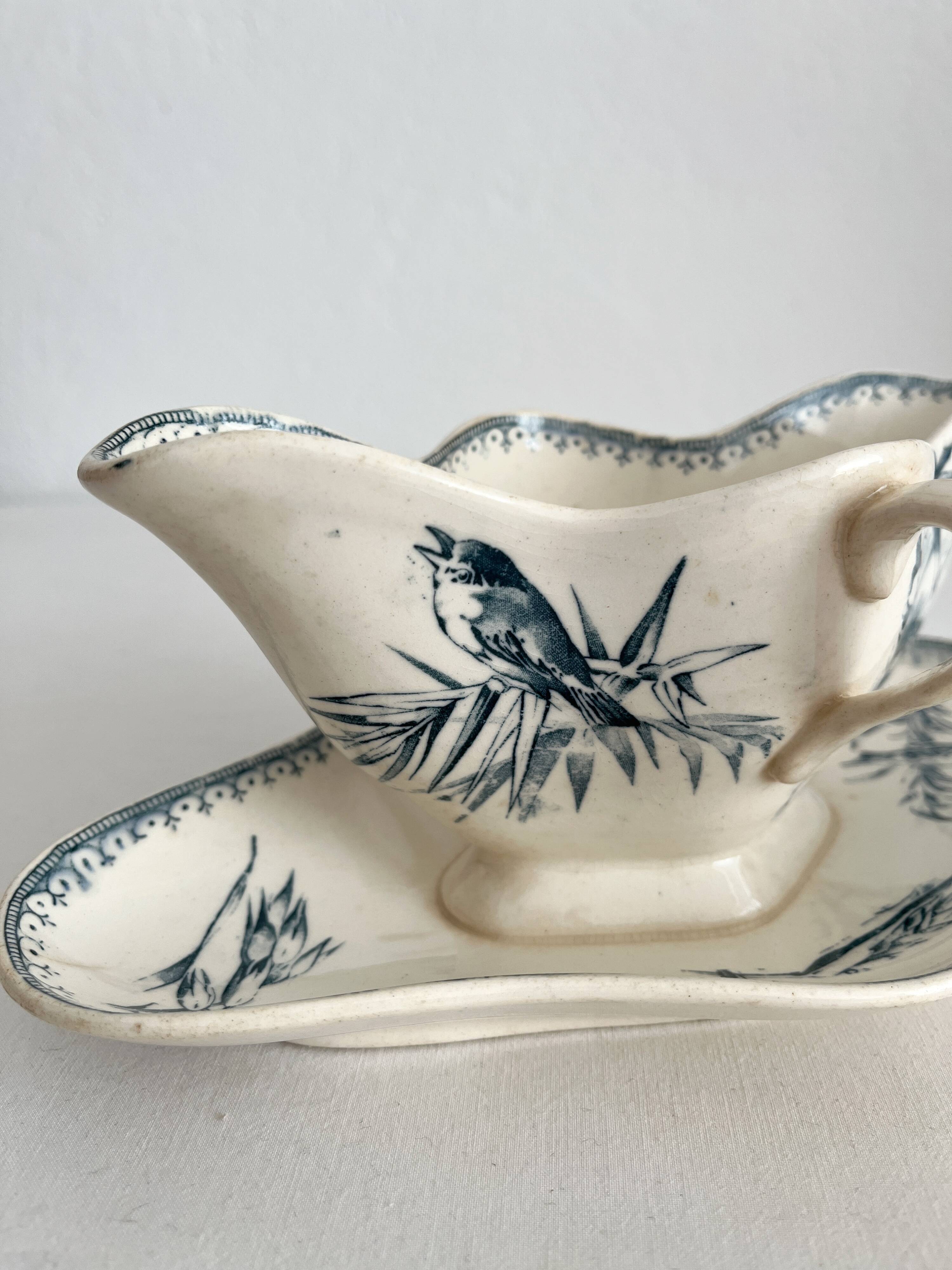 Antique iron earthenware sauceboat with flowers and birds "Malaga" Petrus Regout