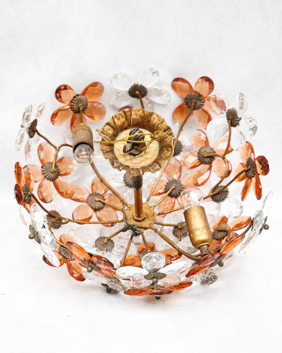 Ceiling light with transparent and peach flowers.