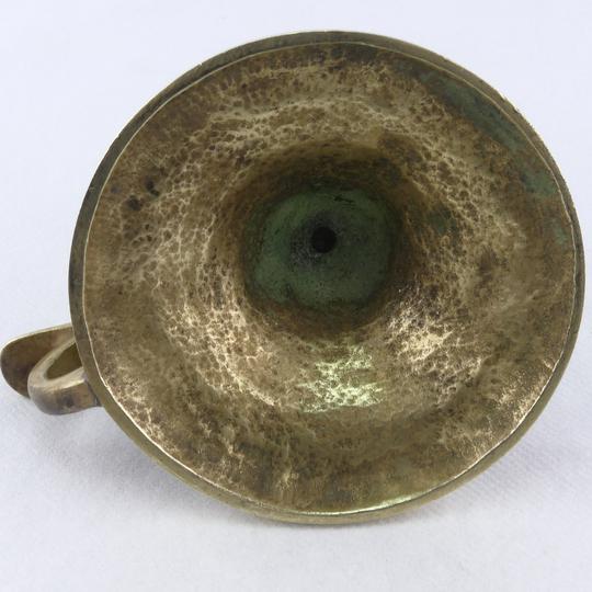 Golden bronze hand-held candlestick