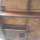 Antique round farmhouse table with drop-leaf doors in solid pegged wood